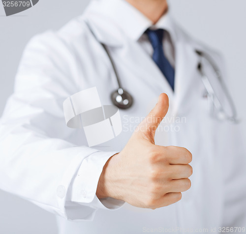 Image of male doctor hand showing thumbs up