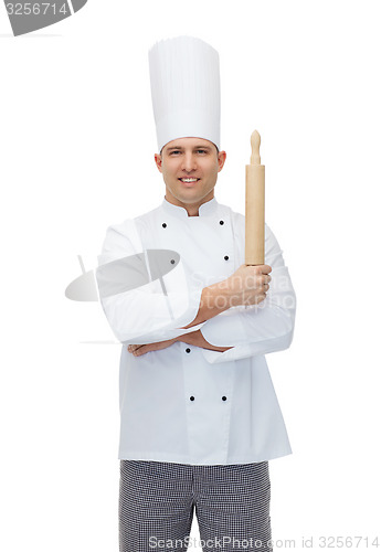 Image of happy male chef cook holding rolling pin