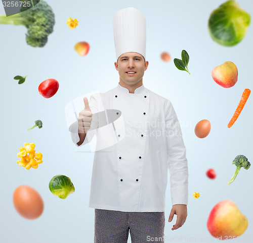 Image of happy male chef cook showing thumbs up