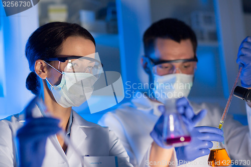 Image of close up of scientists making test in lab