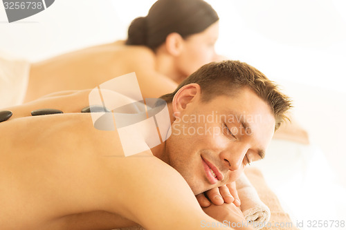 Image of couple in spa with hot stones