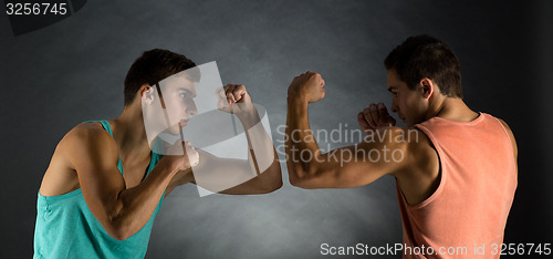 Image of young men wrestling