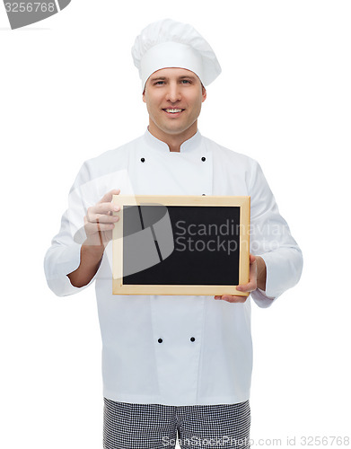 Image of happy male chef cook holding blank menu board