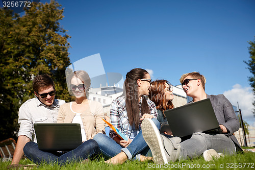 Image of students or teenagers with laptop computers