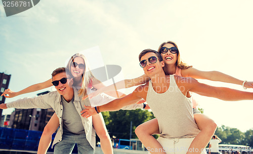 Image of smiling couple having fun in city