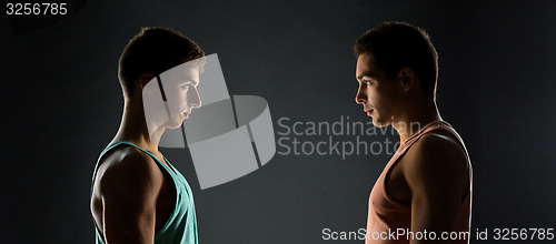 Image of young men looking to each other
