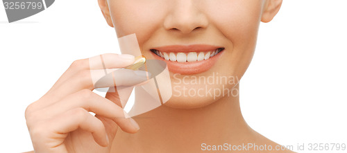 Image of beautiful woman with omega 3 vitamins