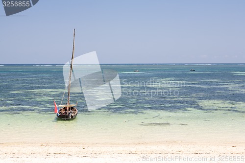 Image of Old wooden arabian dhow in the ocean 