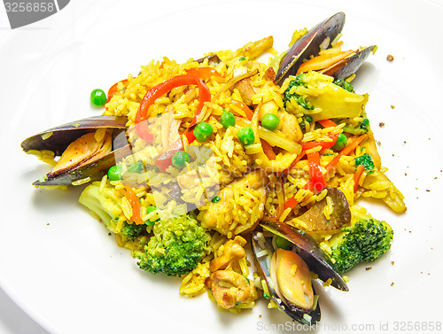 Image of Spanish paella with mussels, food closeup