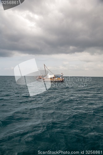 Image of Tourists enjoying sea on yacht. Ship traveling in Kenya