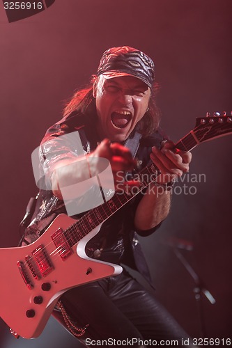 Image of DNIPROPETROVSK, UKRAINE - OCTOBER 31: Matthias Jabs from Scorpions rock band performs live at Sports Palace SC \"Meteor\". \"Final tour\"concert on October 31, 2012 in DNIPROPETROVSK, UKRAINE