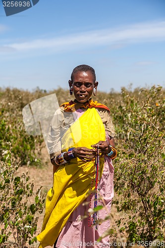 Image of Masai Mara, Kenya, Africa - February 12, 2010 woman in traditional clothes