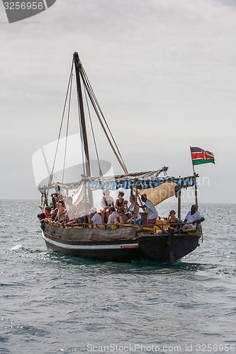 Image of Tourists enjoying sea on yacht. Ship traveling in Kenya