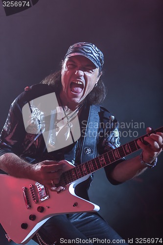 Image of DNIPROPETROVSK, UKRAINE - OCTOBER 31: Matthias Jabs from Scorpions rock band performs live at Sports Palace SC \"Meteor\". \"Final tour\"concert on October 31, 2012 in DNIPROPETROVSK, UKRAINE