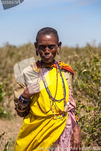 Image of Masai Mara, Kenya, Africa - February 12, 2010 woman in traditional clothes