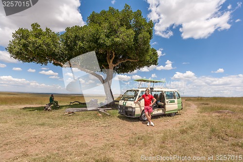 Image of Woman and Men in savanna 