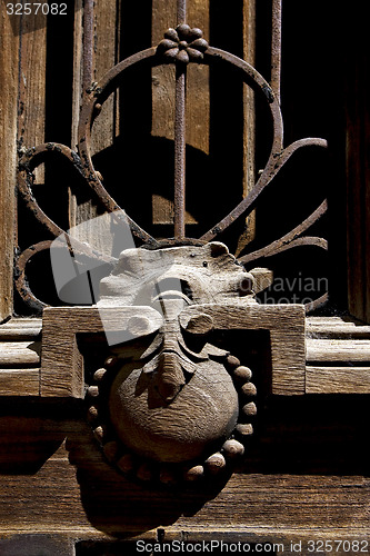 Image of closed brown wood  door