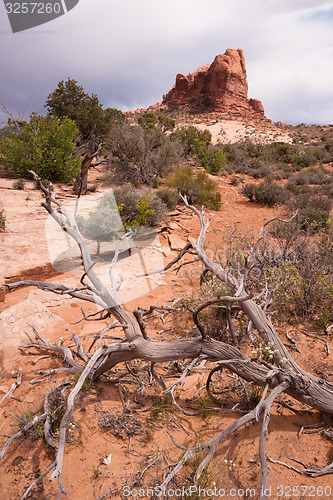 Image of Rain Clouds Gather Over Rock Formations Utah Juniper Trees