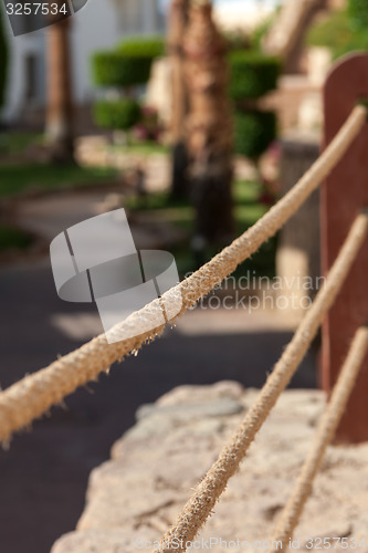 Image of the rope fence of pier in summer vacation time 