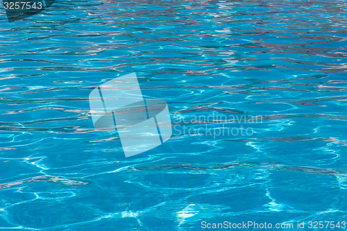 Image of beautiful clear pool water reflecting in the sun