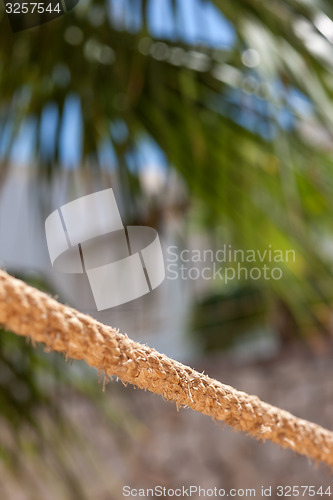 Image of the rope fence of pier in summer vacation time 