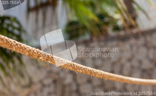 Image of the rope fence of pier in summer vacation time 