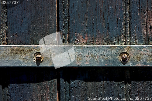 Image of  old iron metal lock and wood