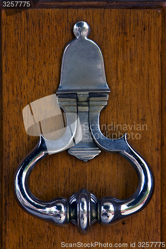 Image of silvery knocker in door la boca  buenos aires