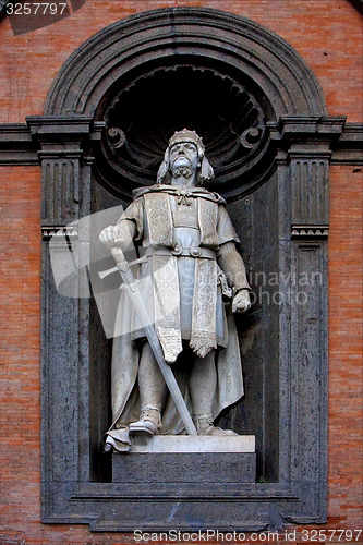 Image of grey marble statue of a warrior  