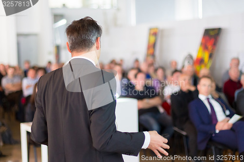 Image of Speaker at Business Conference and Presentation.