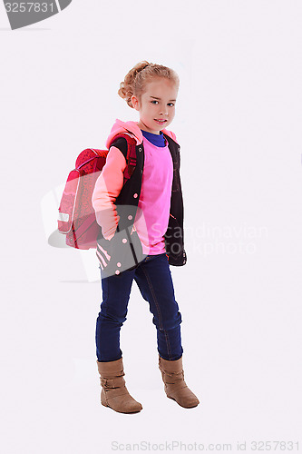 Image of Girls, fashionably dressed with school bag on the back.