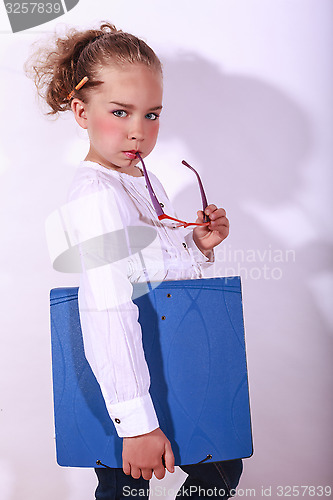 Image of Young girl this holds a document folder in hand