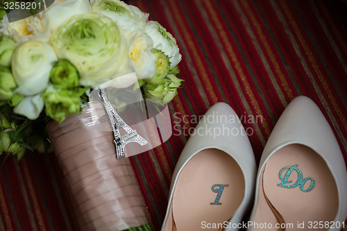 Image of wedding shoes and bouquet 
