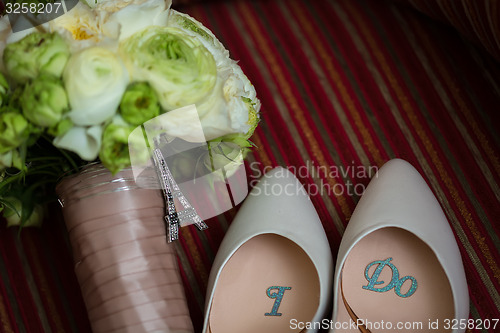 Image of wedding shoes and bouquet 