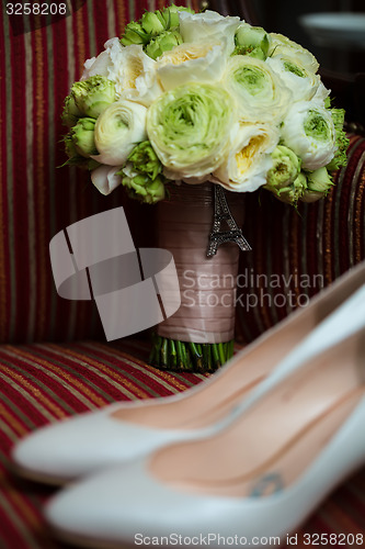 Image of wedding shoes and bouquet 