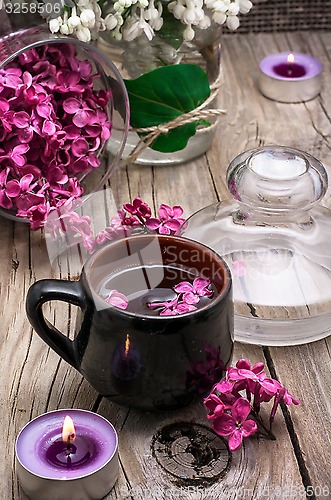 Image of fragrant tea and a branch of lilac