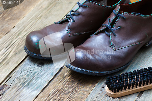 Image of vintage boots, brush and shoe polish