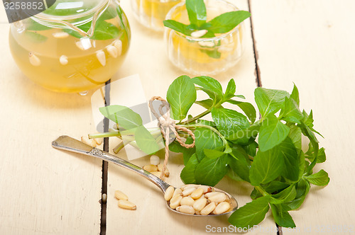 Image of Arab traditional mint and pine nuts tea