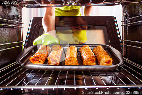 Image of Cooking in the oven at home.