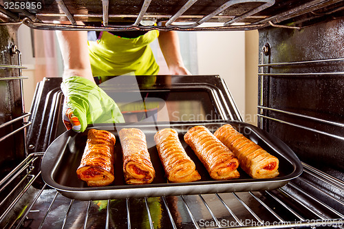 Image of Cooking in the oven at home.