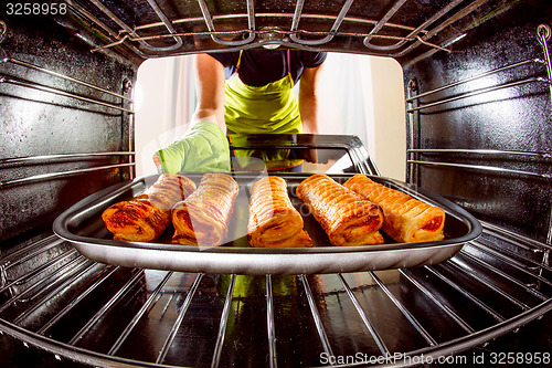 Image of Cooking in the oven at home.