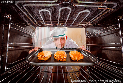 Image of Chef cooking in the oven.