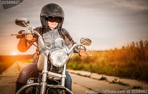 Image of Biker girl on a motorcycle