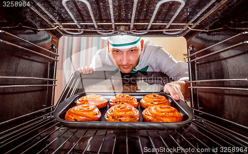 Image of Chef cooking in the oven.