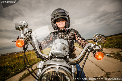 Image of Biker girl on a motorcycle