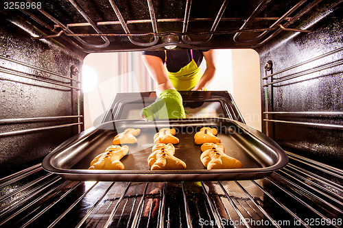 Image of Baking Gingerbread man in the oven