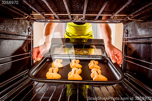 Image of Baking Gingerbread man in the oven