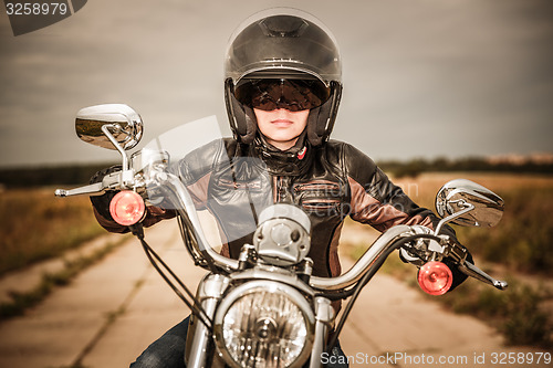 Image of Biker girl on a motorcycle