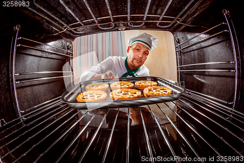 Image of Chef cooking in the oven.