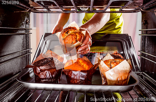 Image of Baking muffins in the oven